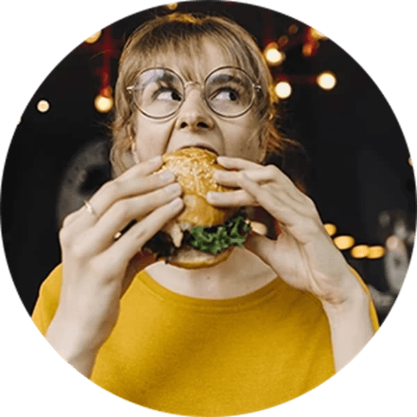 a lady eating a burger