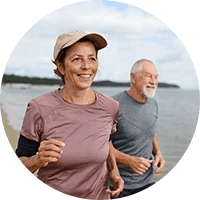 a couple running on the beach